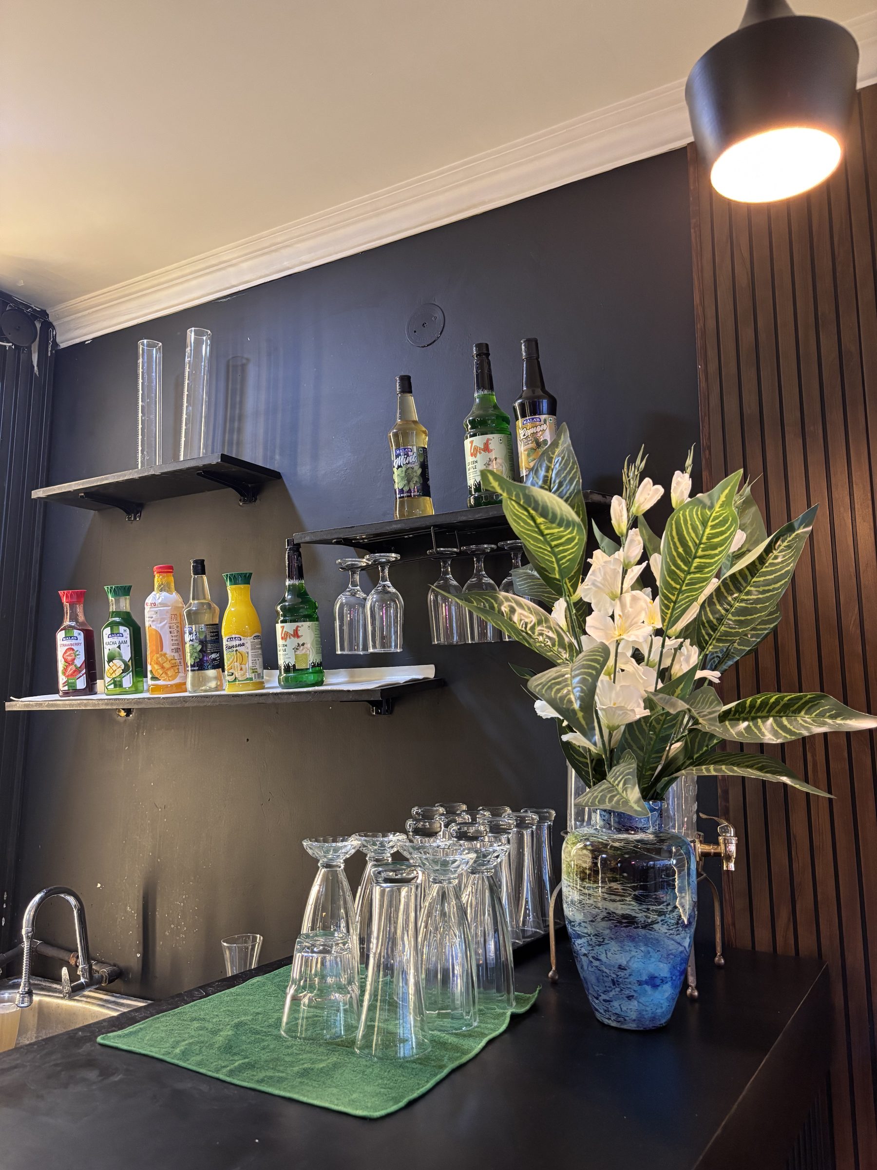 Bar counter and neon sign at Café Go Dutch
